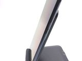 a cell phone that is sitting on top of a stand