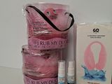 a bag of pink stuff sitting next to a bottle of perfume