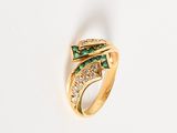 an image of a gold ring with green and white stones