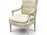 une image représentant une chaise blanche dont l'assise est recouverte d'un tissu à motifs floraux