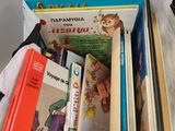 a pile of books sitting on top of a table