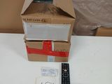 a box that has a remote in it on a table