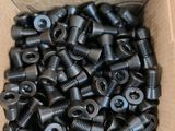 a box full of screws and nuts in a cardboard box