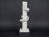 sculpture of a white sculpture with a spiral design on top of a black base