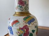 a lamp that is sitting on a table with a lamp shade on it
