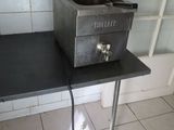 a stove that is sitting on a table in a kitchen