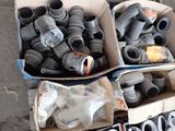 many different types of pipes and fittings in a box