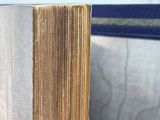 a close up of a book sitting on top of a wooden table