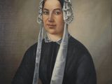 portrait of a woman in a black dress with a white head scarf