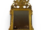 an image of a gold frame with a mirror on it