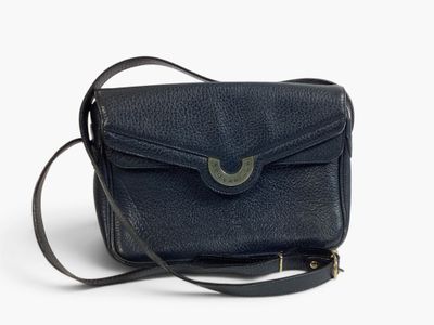 black leather cross body bag on white background with strap