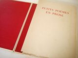 a book with a red cover sitting on a table