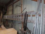 a long metal shelf with a bunch of tools on it