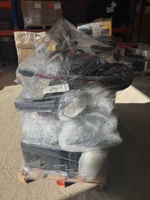 a large pile of items sitting on a pallet in a warehouse