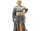 figurine of a woman in a blue dress with a blue cape