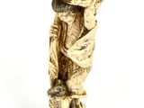an image of a statue of a man on a stool