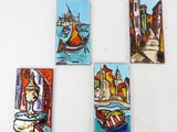 four small paintings of boats and buildings on a white surface