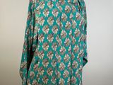 a woman ' s blouse on a mannequin mannequin mannequin mannequin mannequin mannequin mannequin mannequin mann