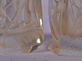two vases that are sitting next to each other
