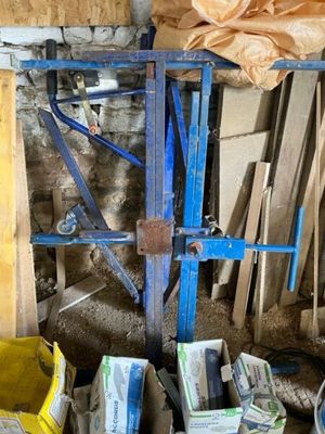 a pile of boxes and boxes of wood in a room