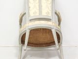 a chair that is sitting in the corner of a room