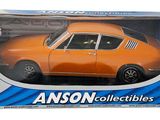 an orange toy car in a box on a white background