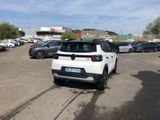 a white car that is parked in a parking lot
