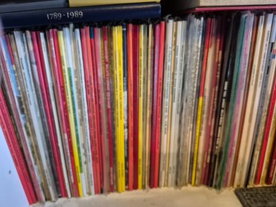 a lot of vinyl records on a shelf in a room