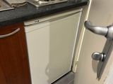 a kitchen with a sink, dishwasher, and dishwasher in it