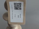 a white candle that has a tag on it