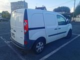 a white van that is parked in a parking lot