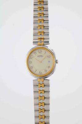 an image of a close up of a wrist watch on a white surface