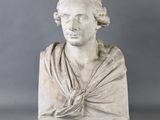 marble bust of a woman with a shaw around her neck