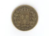 an old coin with a coat of arms and a crown on it