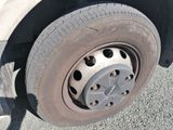 a close up of a flat tire on a truck