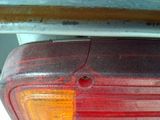 a close up of a red light on a car ' s tail light