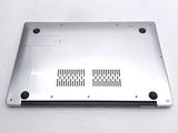 a silver laptop that is sitting on a white surface