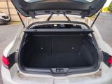 a trunk of a white car with its trunk open