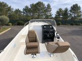 a boat with two seats on the back of it