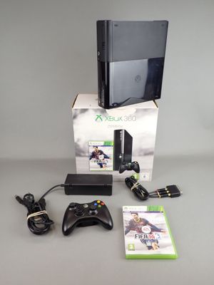 a video game console and a game controller on a table