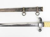 two old swords are displayed next to each other on a white surface