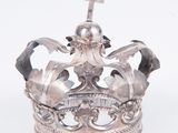 an old silver crown with a cross on top on a white background