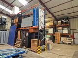 a large warehouse with a lot of boxes on the shelves