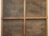 an image of a wooden screen door with a window on it