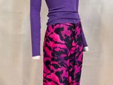 a mannequin wearing a purple top and purple pants