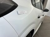 a white car with a sticker on the side of it
