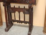 a small wooden table with a mirror on top of it