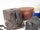 many different types of camera cases on a white surface