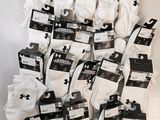 several pairs of white socks are stacked on top of each other