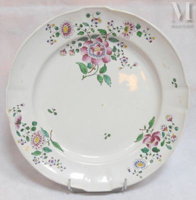 a plate with a floral design on it on a table